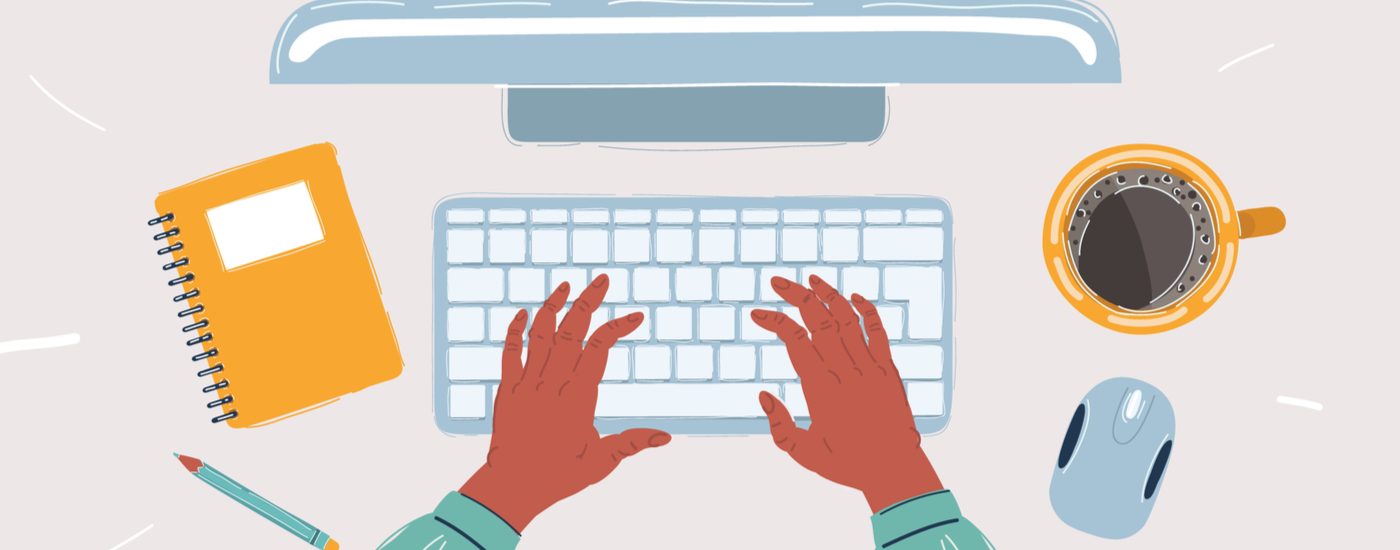 Top view of working desk with a computer and typing hands on a keyboard.